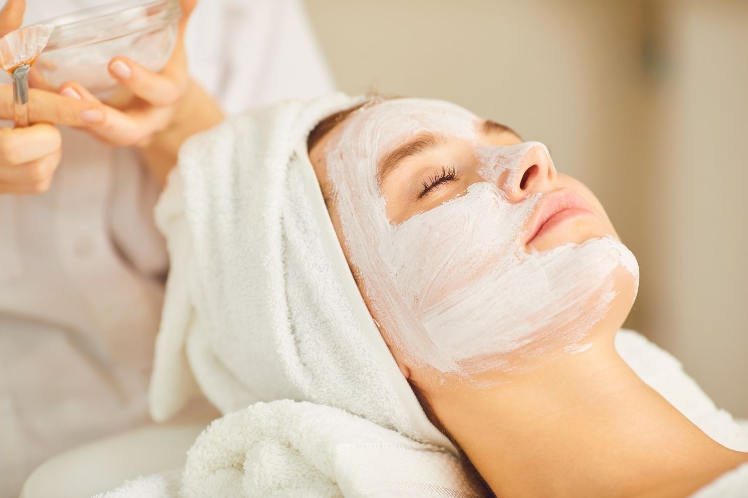 Close up of a woman recievieng a facial peel treatment